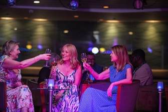 Fred. Olsen Cruise Lines Guests with drinks in the Lido lounge, Balmoral.jpg